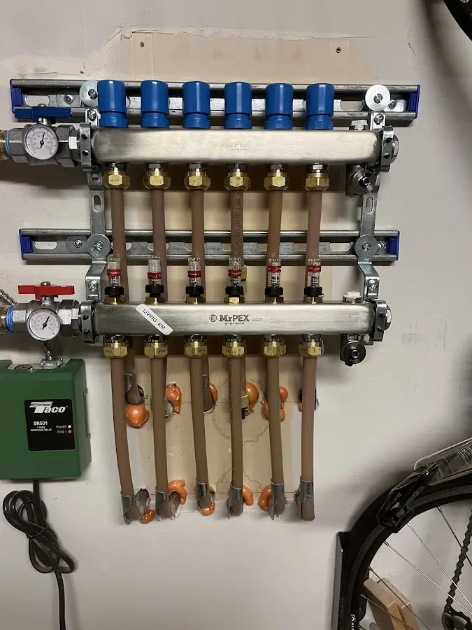 Plumber performing Water Heater Repair at a residential property in Collingswood